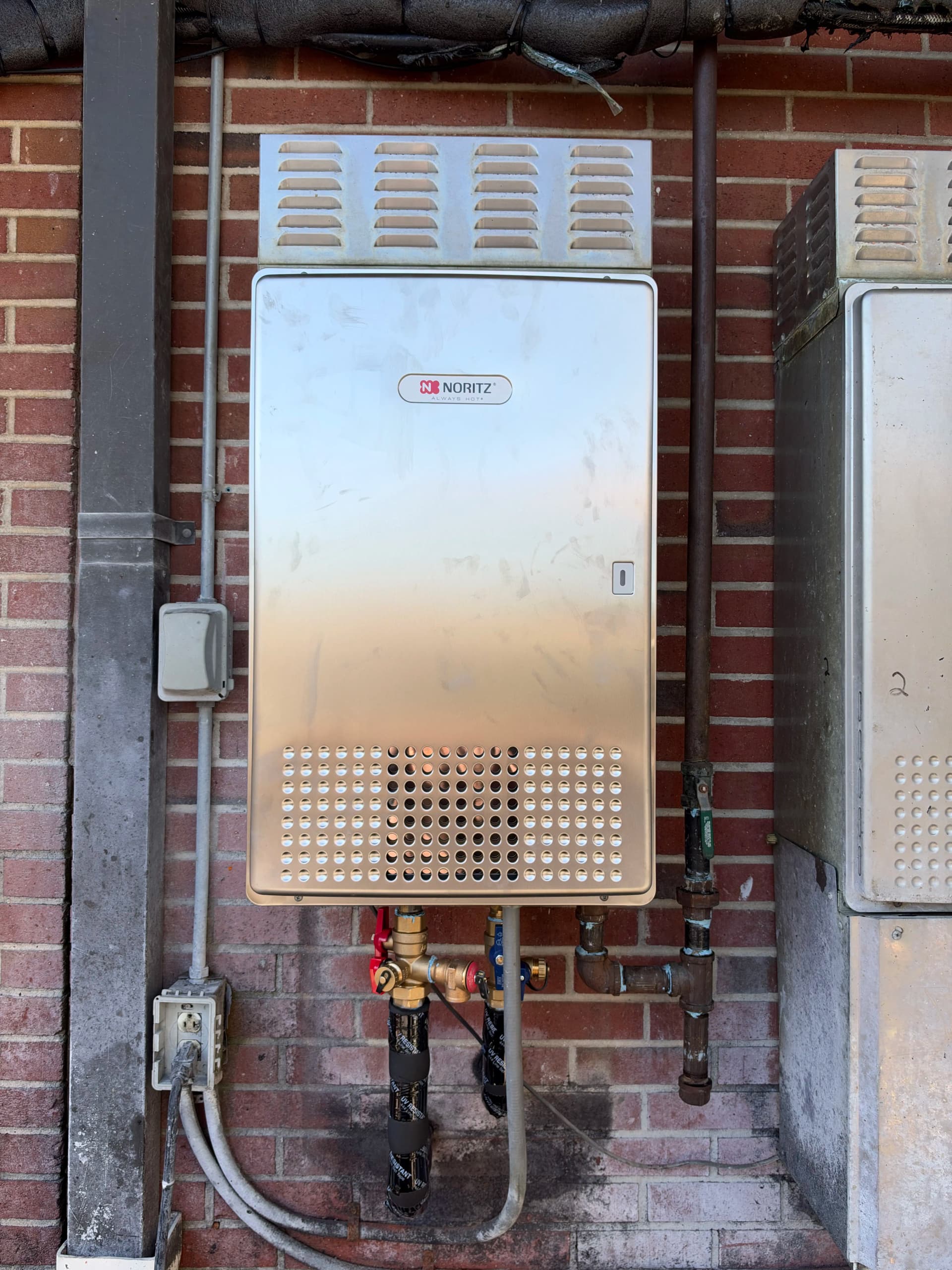 Commercial Tankless Water Heater Install Keeping Hot Water Flowing image